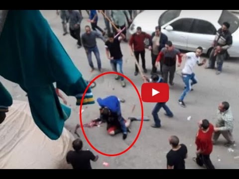 زوج يحاول ذبح زوجته في الشارع أمام الجميع